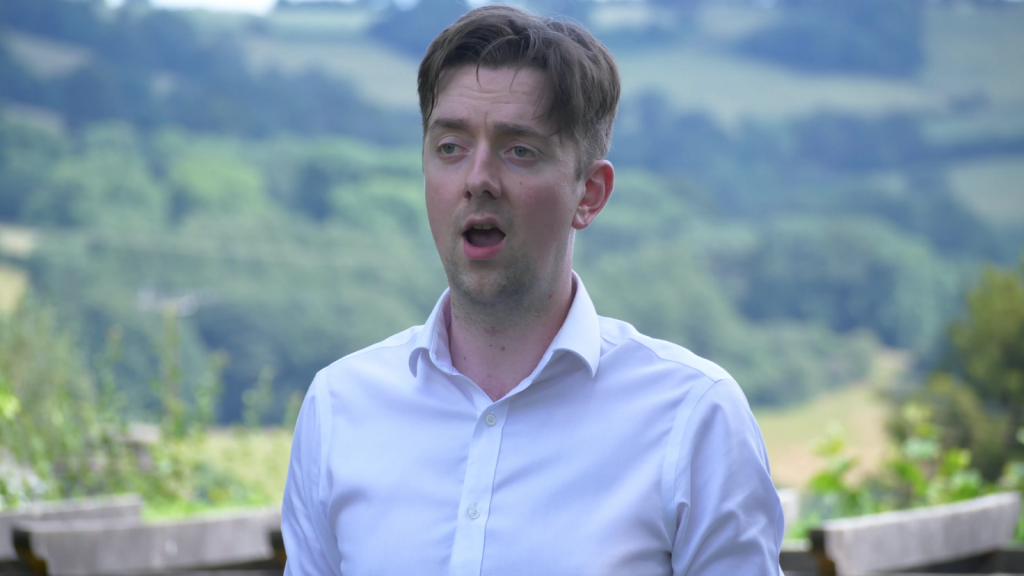 Michael Craddock sings in a garden